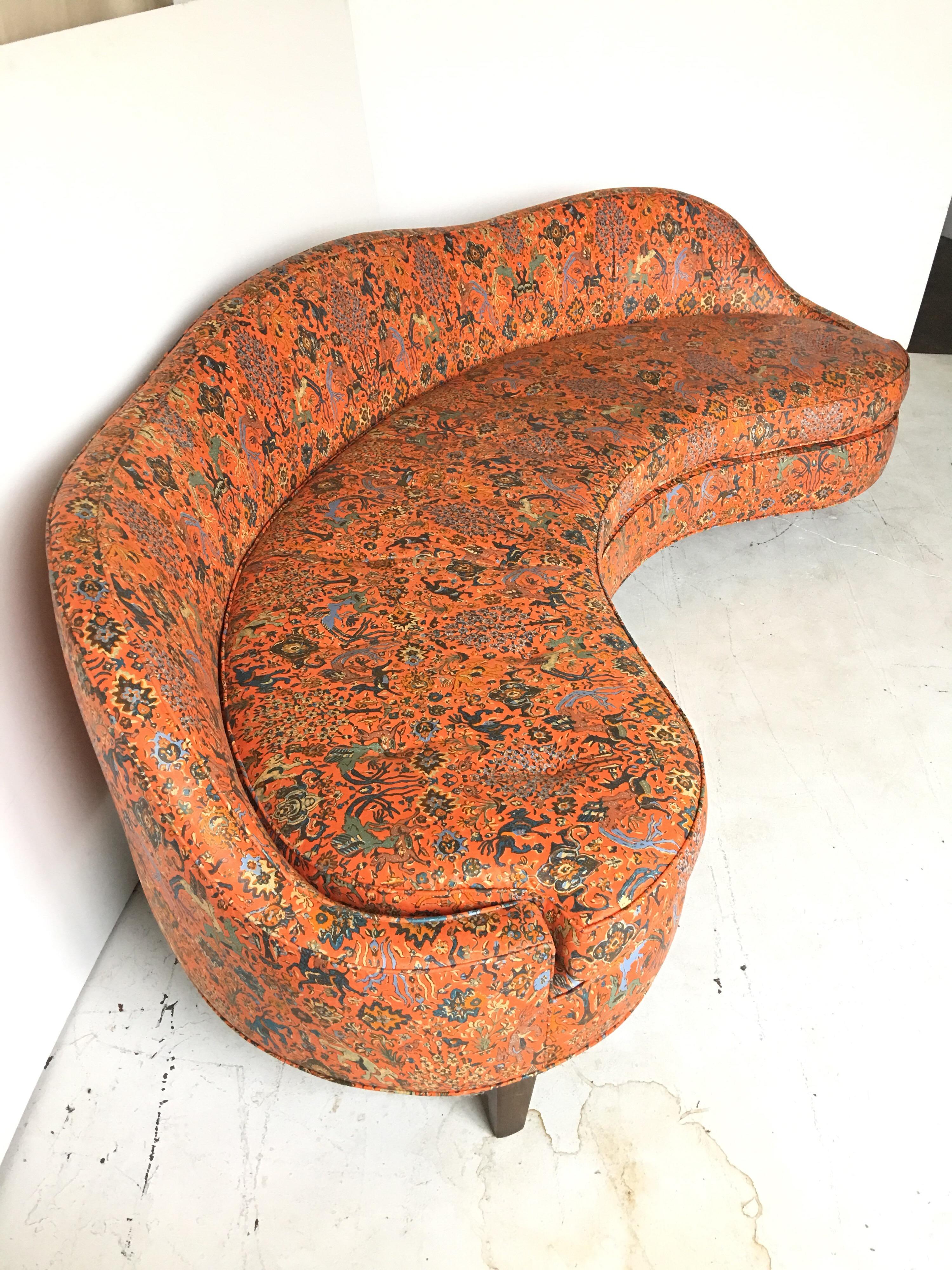 This is a very unusual example of a signed Dunbar curved sofa. It is very much in the manner of the 
