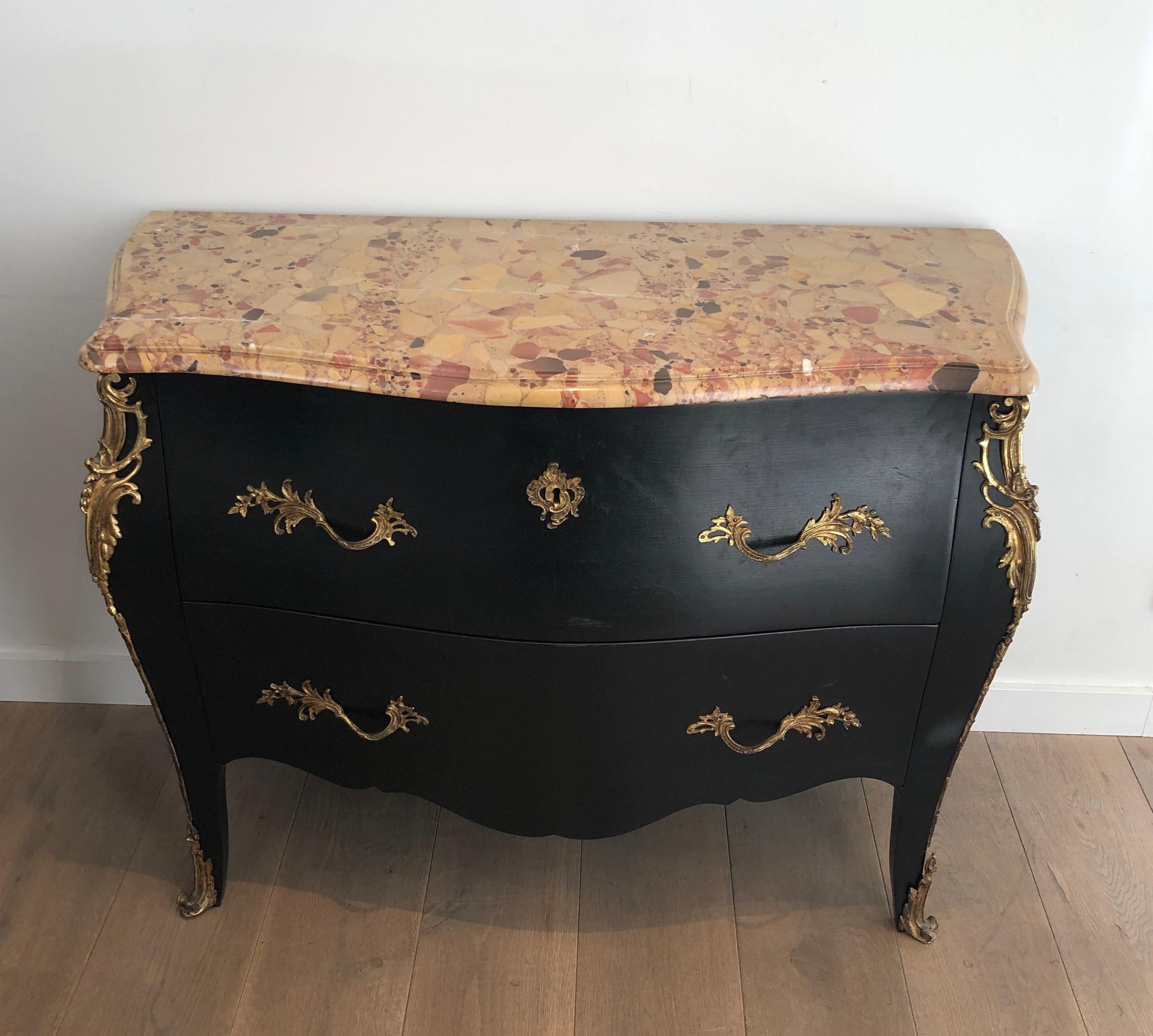 This very nice curved chest of drawers is made of ebonized wood with finely chiseled bronze elements. The piece is stamped by De Beyne Roubaix. This is a Frenh work, circa 1880.