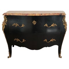 Commode incurvée en bois d'ébène avec éléments en bronze estampillée De Beyne Roubaix