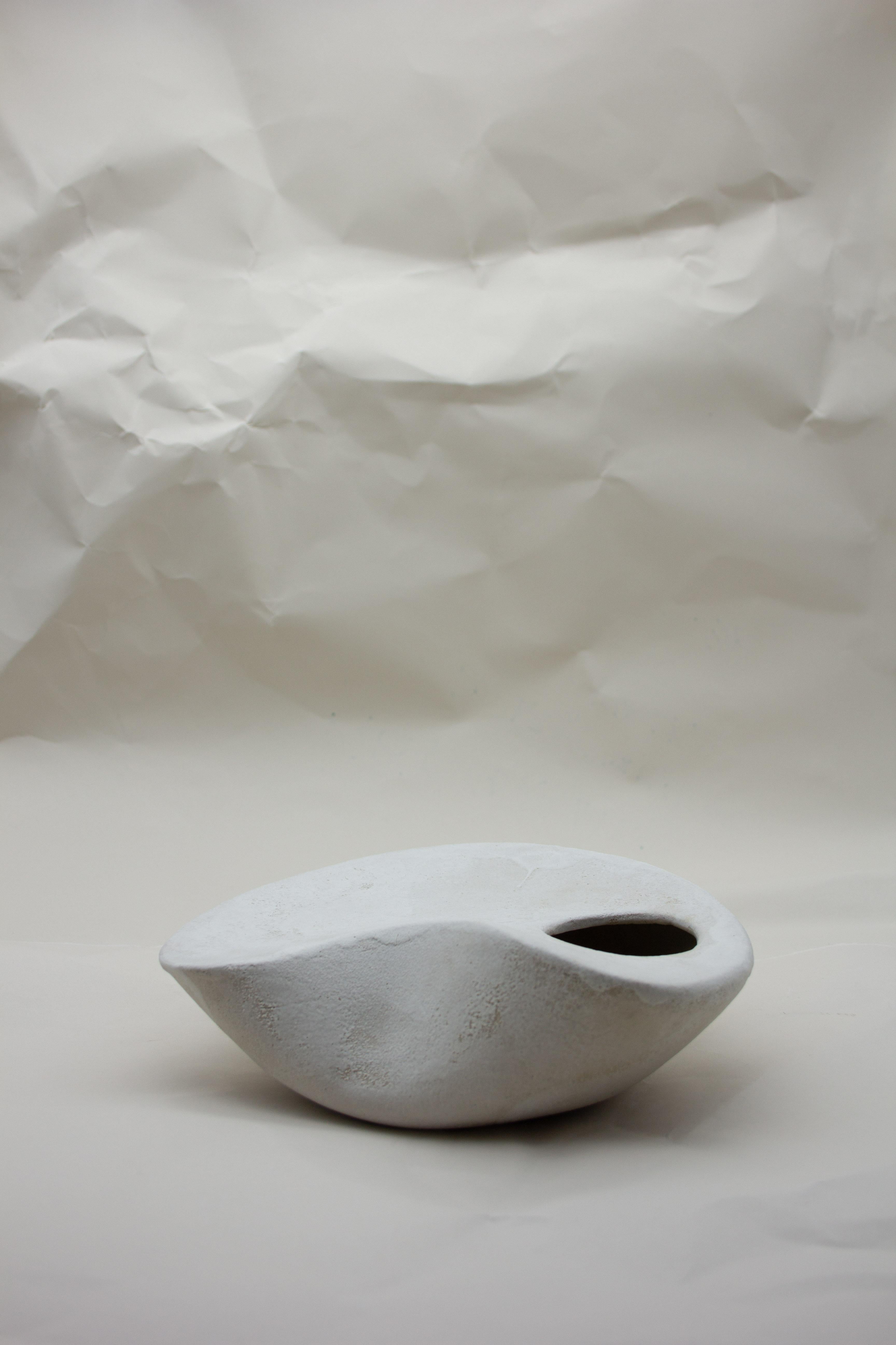 The Curved Form blurs the boundary between a functional vase and a sculptural object. Created as part of the Soft, Soft Hard 2018 Collection, this piece is an exploration into form and the relationship between the wheel and hand building, with a nod