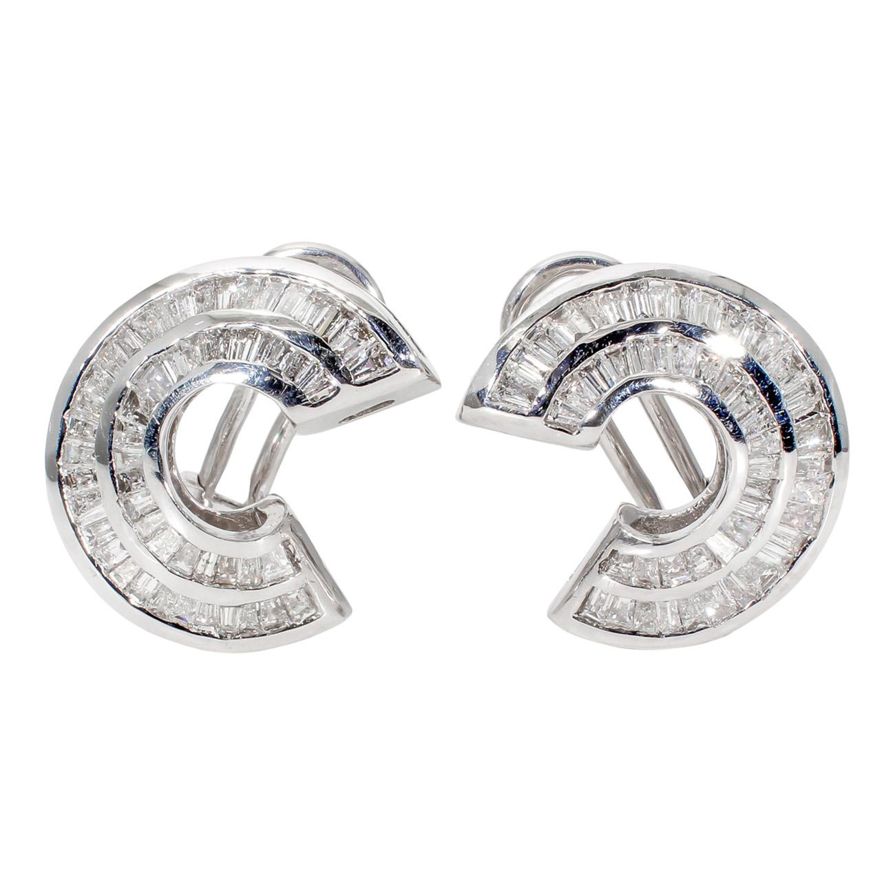 Curved French clip earrings in 14k white gold with channel set tapered baguette diamonds.  D2.75ct.t.w.