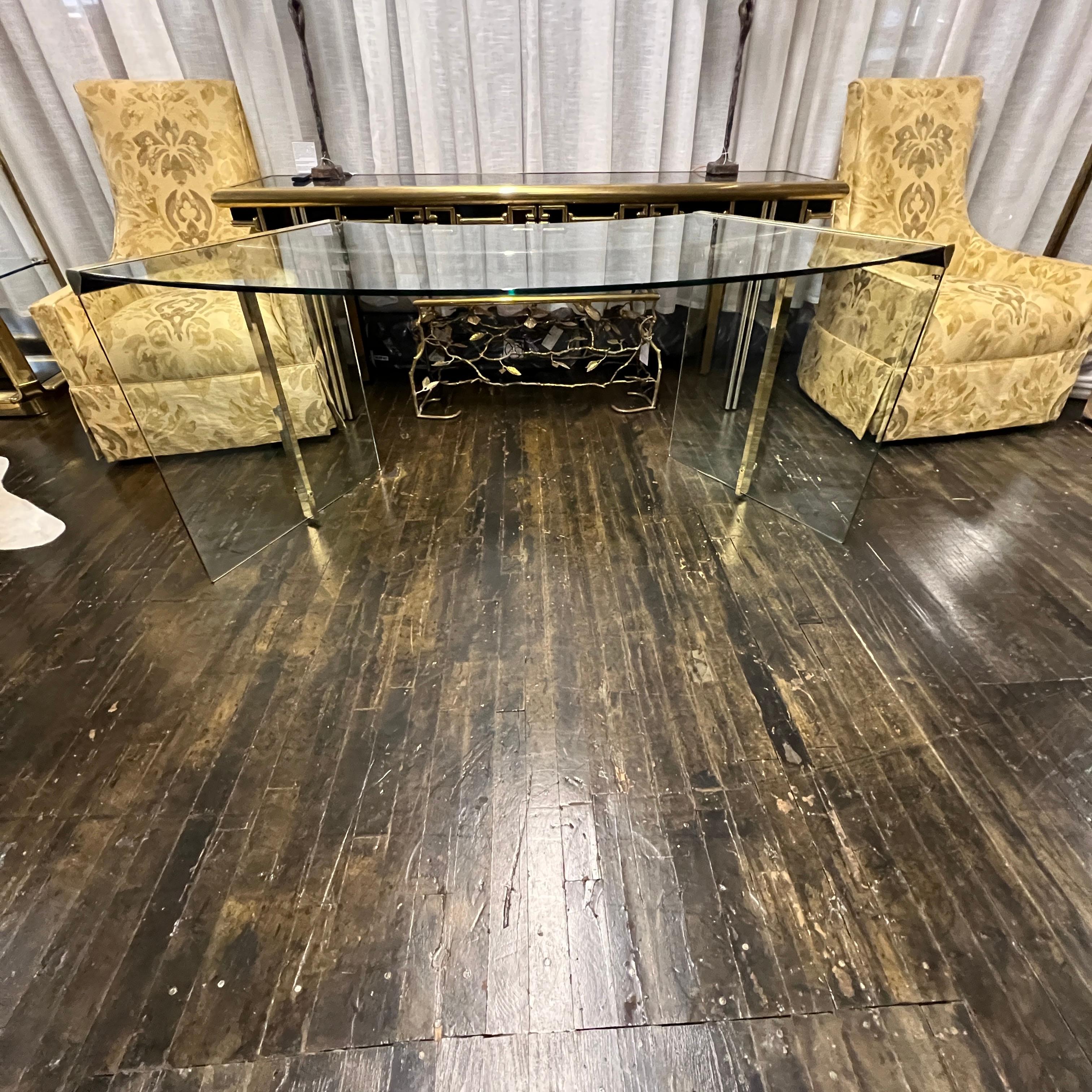 Lovely curved desk made of glass with a brass frame. Originally designed by Gallotti & Radice in 1971 and marketed as the President desk (there were two version of this desk - 2 sizes.  This is the smaller of the 2 versions - the junior).  Marked