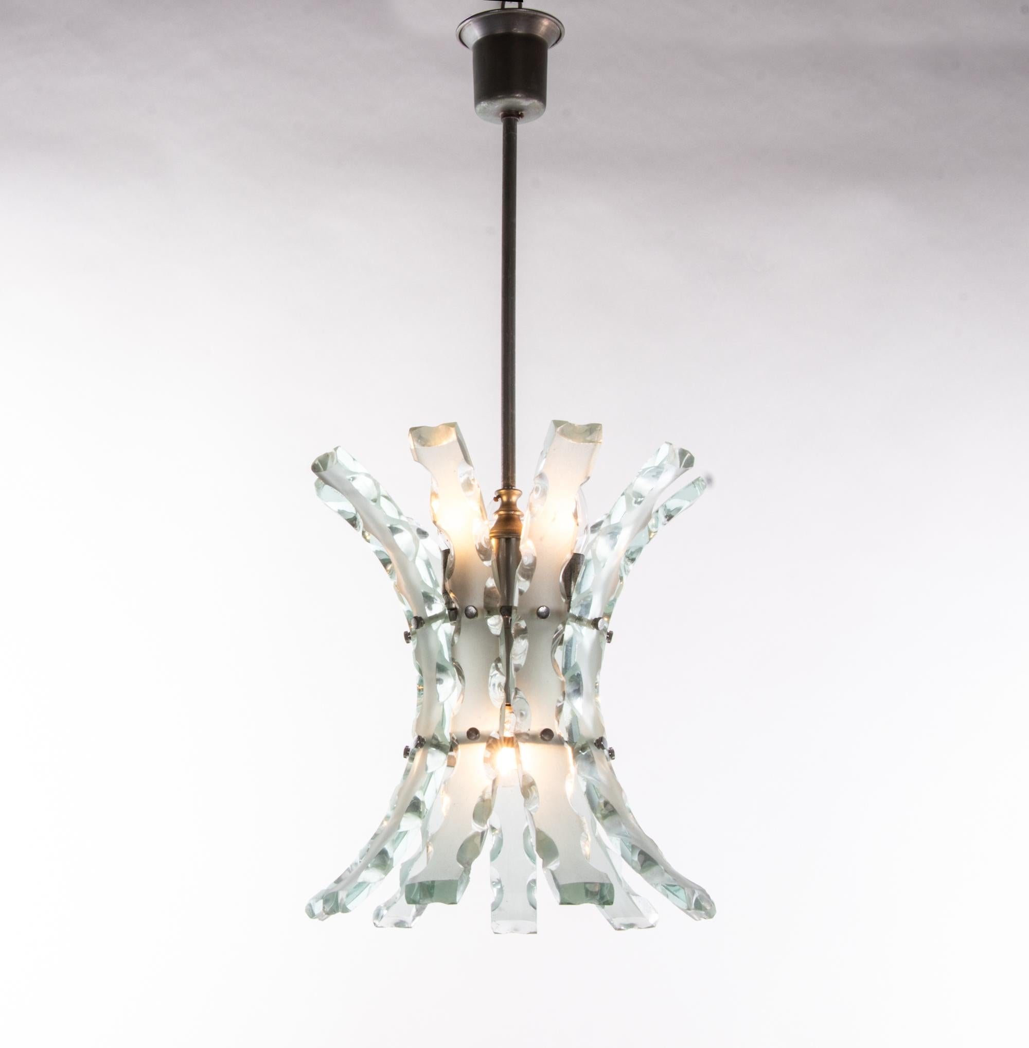 Curved glass chandelier by O4 (Zero Quattro) edited by Fontana Arte, Milano, Italy in the 1970s. Zero Quattro was a very small company based in Milan, Italy. A real eye-catcher and an excellent example of art glass from Italy. 
 
Colors: turquoise