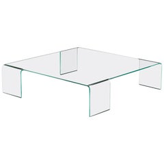Mesa baja de cristal curvado
