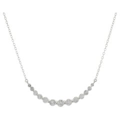 Collana con barrette di diamanti curve e graduate in oro bianco 14KT