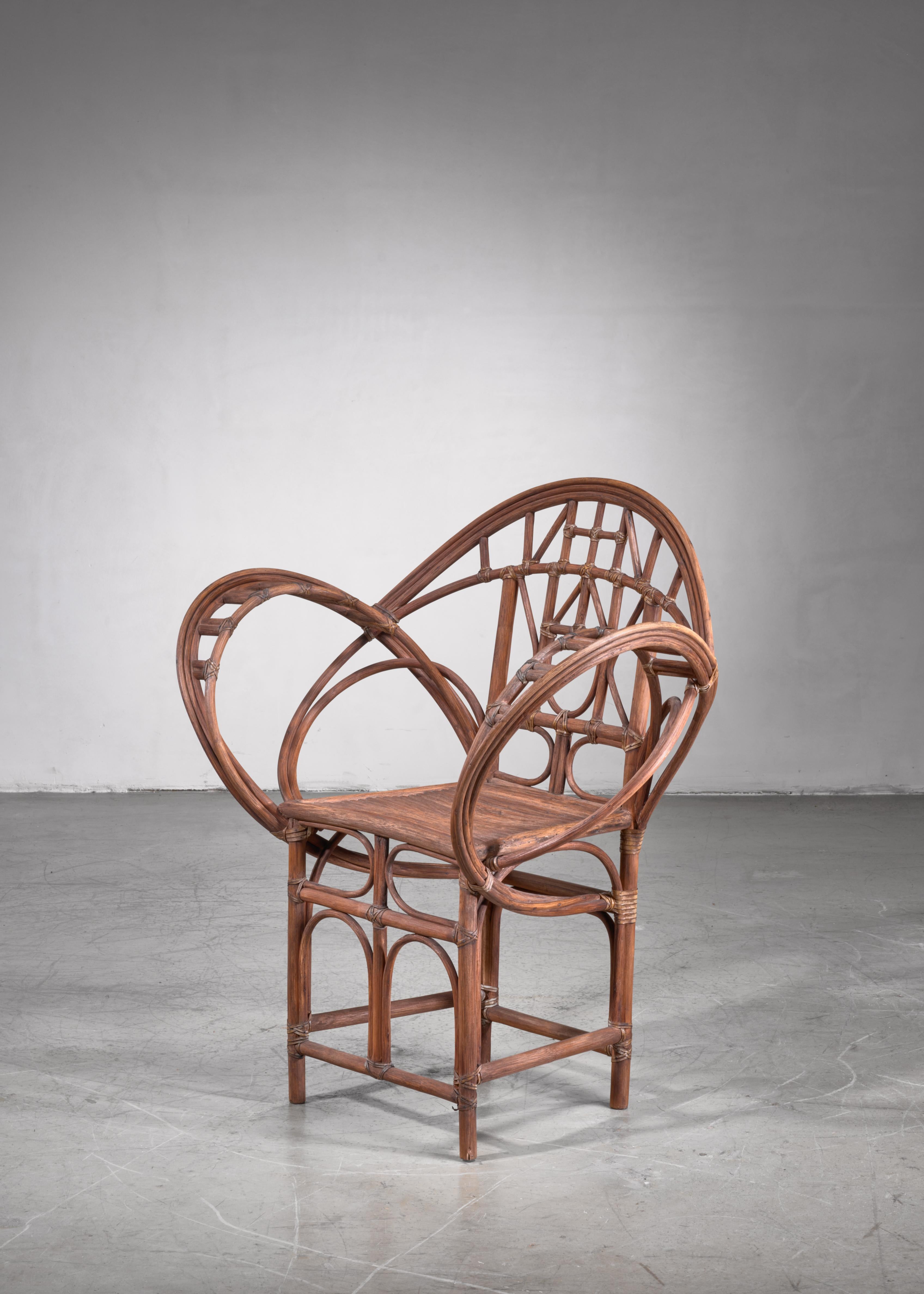 An early 20th century hand-crafted Austrian chair made of curved willow, connected with rawhide strips.