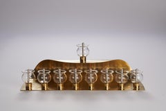 Curved Hanukkiah in Brass, Glass and Silver Mokume Gane by Iris Tutnauer