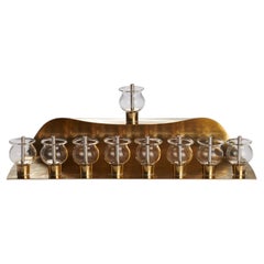 Curved Hanukkiah in Brass, Glass and Silver Mokume Gane by Iris Tutnauer