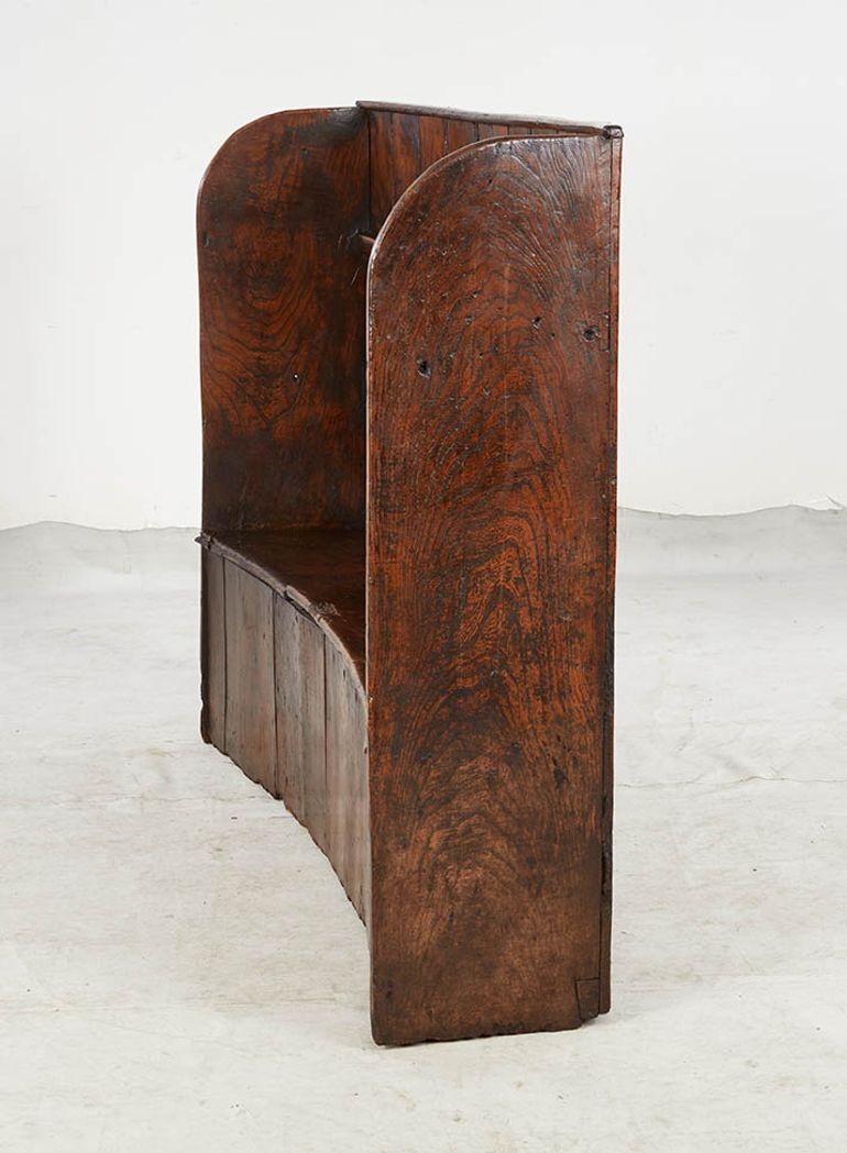 Early 19th Century Curved High Back Elm Settle with Storage For Sale
