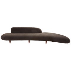 Curved Midcentury Ottoman Reupholstered in Charcoal Faux Shearling