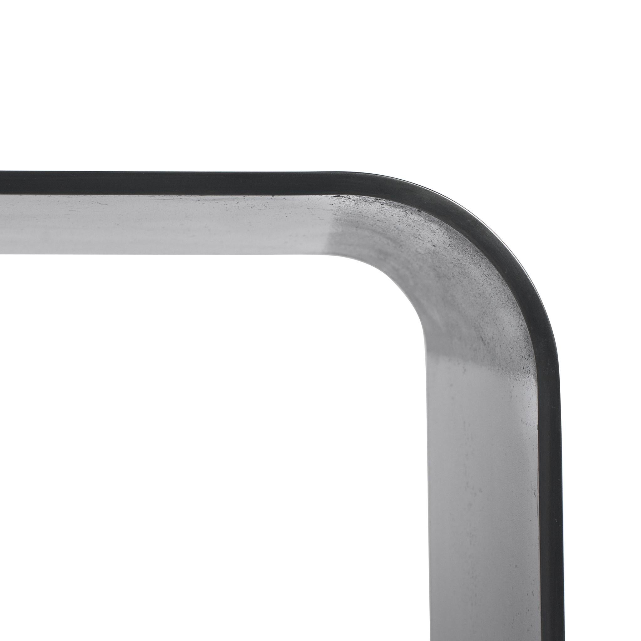 The Lin bench is an exploration into the finishes possible with steel. It’s simple radius curves makes the Lin bench a clean, Minimalist piece. At closer glance the rich texture of hot rolled steel are stunning and are accentuated by its blackened