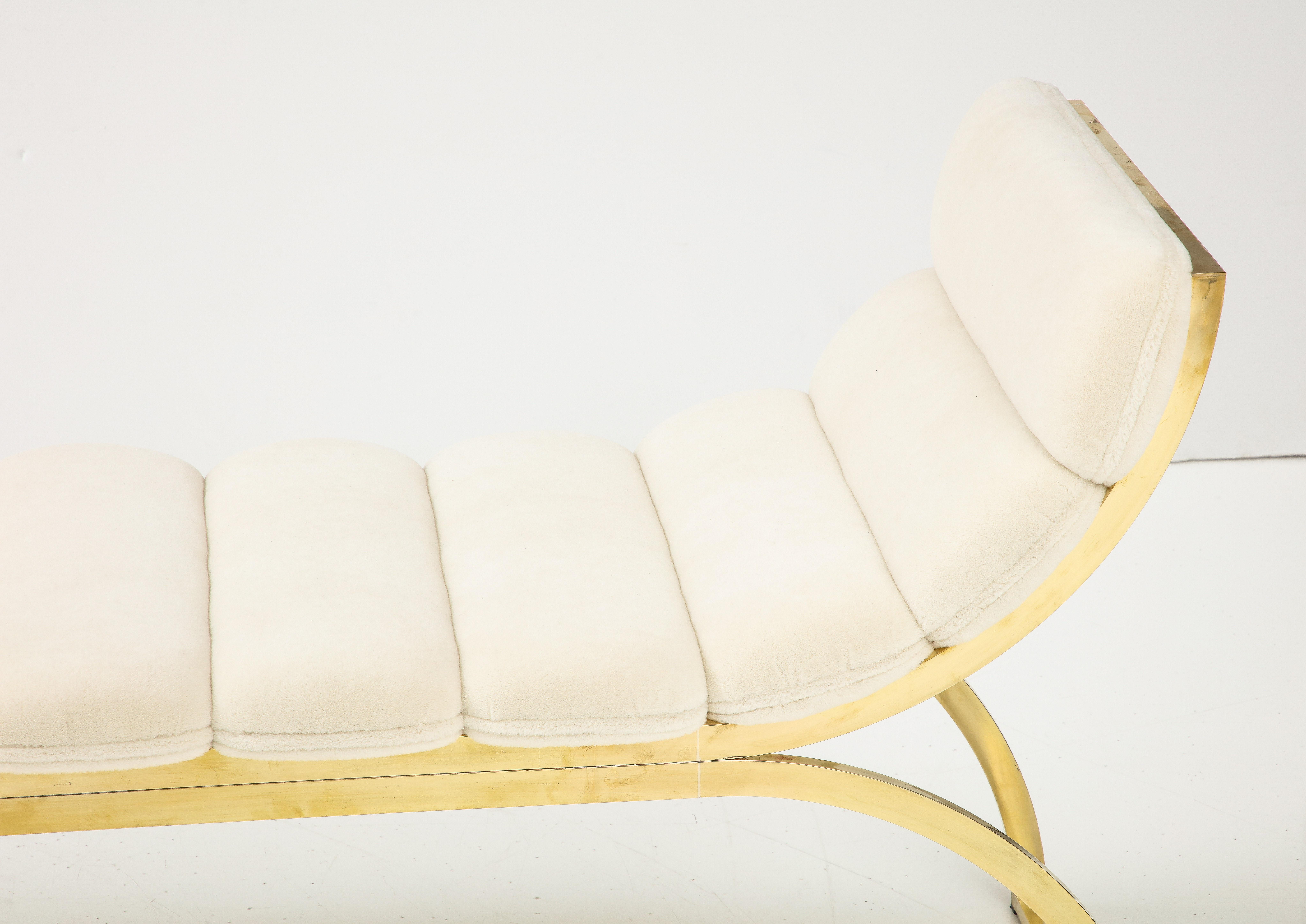 Bespoke Curved Polished Brass Bench consisting of two inverted U-shaped polished brass frames. Minimalistic design. Upholstered in a segmented cushion form with imported Bisson Bruneel boucle in ivory hue. Handmade in Italy. This bench is on display