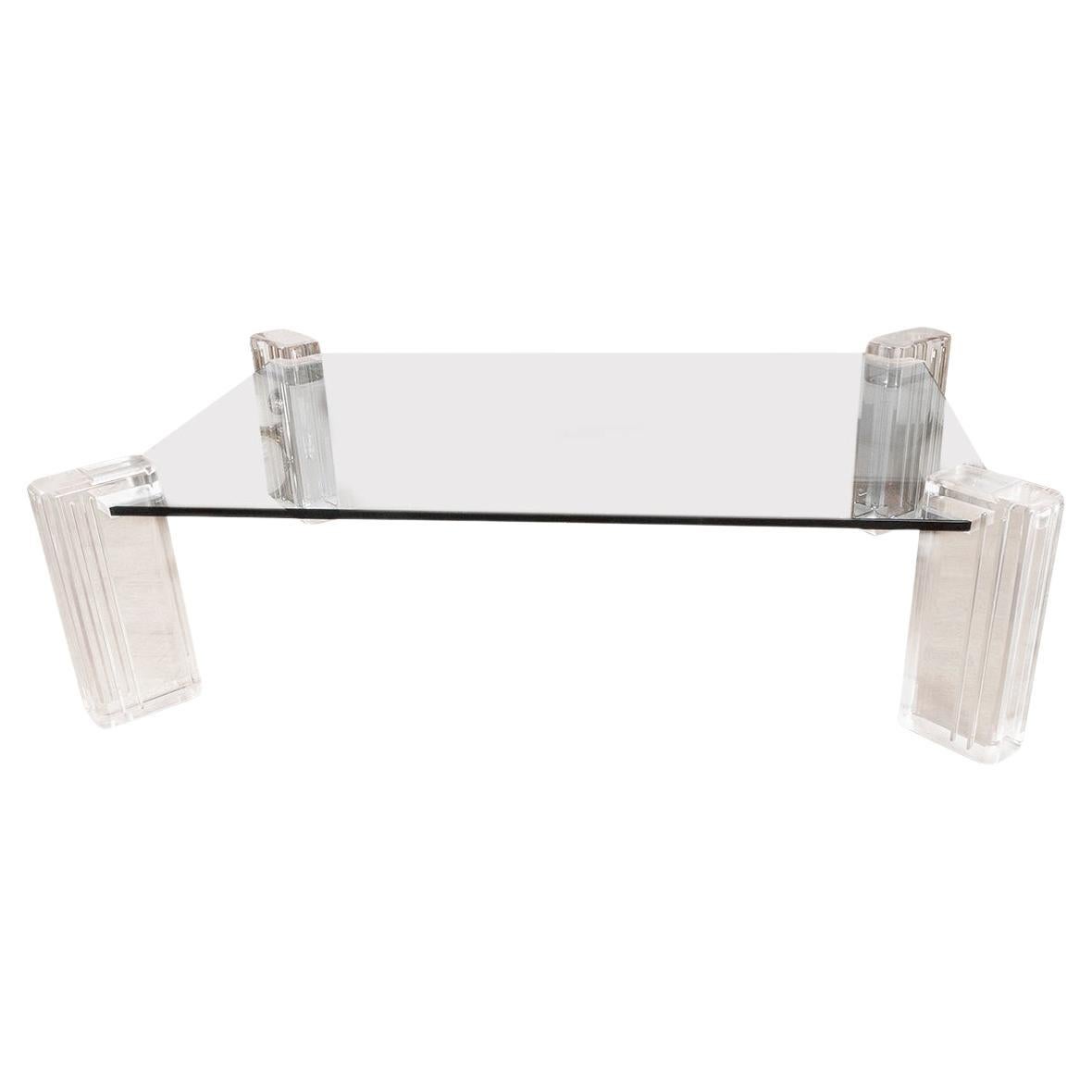 Curved polished nickel side table with cantilevered glass top. 