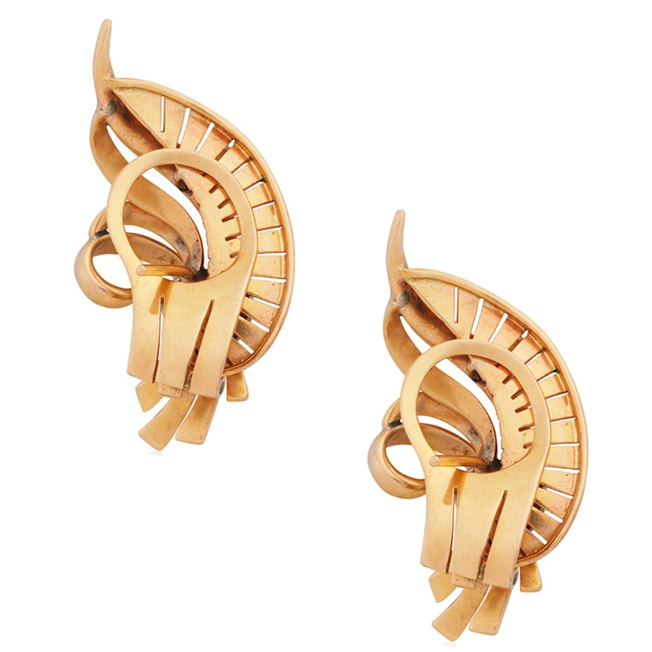 A curved pair of scroll earrings with 3 single-cut diamonds each. 14K White and Yellow Gold. Earring Size: L 3.5 x W 1.8 cm. Earring Back: French Clip.