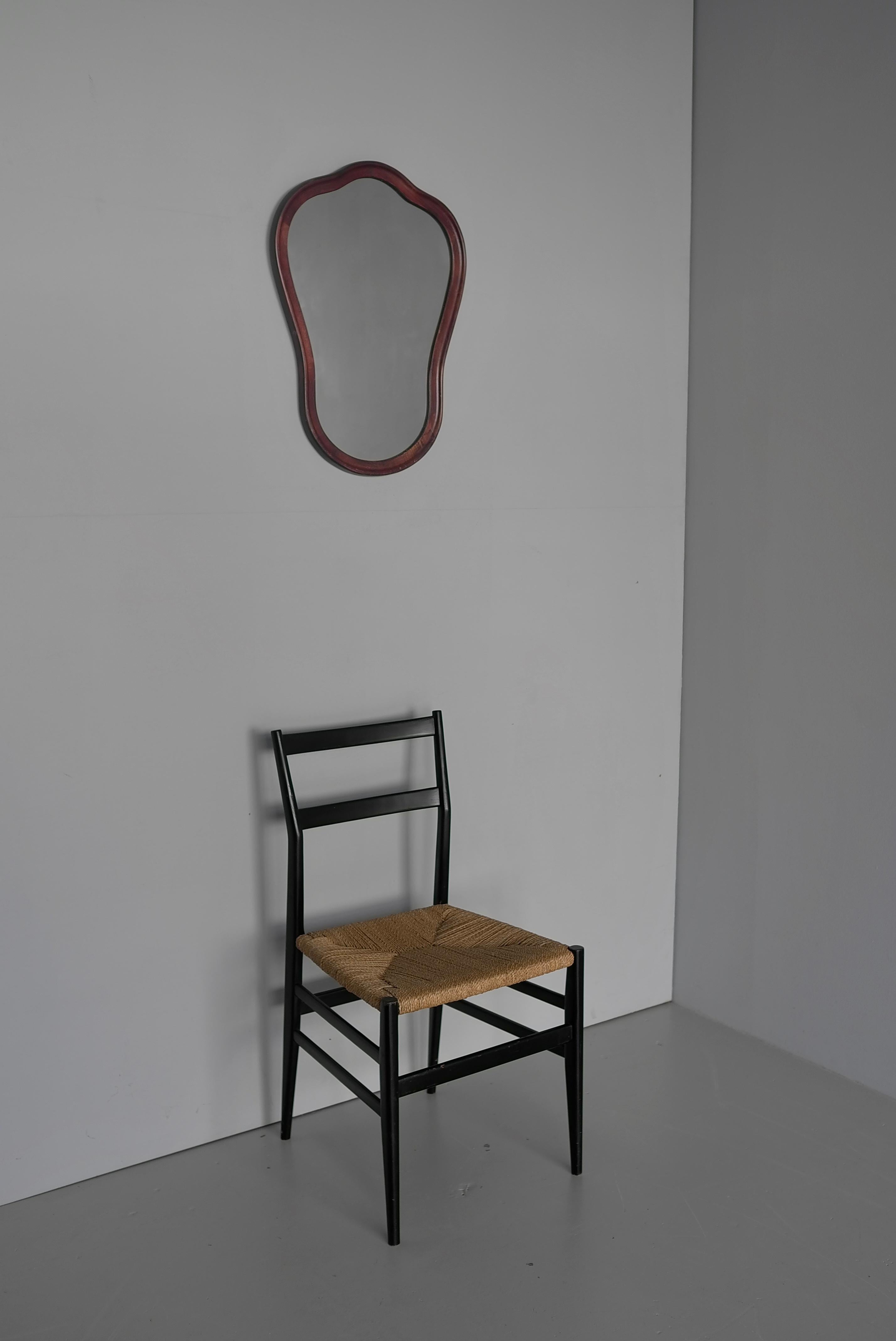 Curved Sculptural wooden wall hanging mirror Italy 1960's



