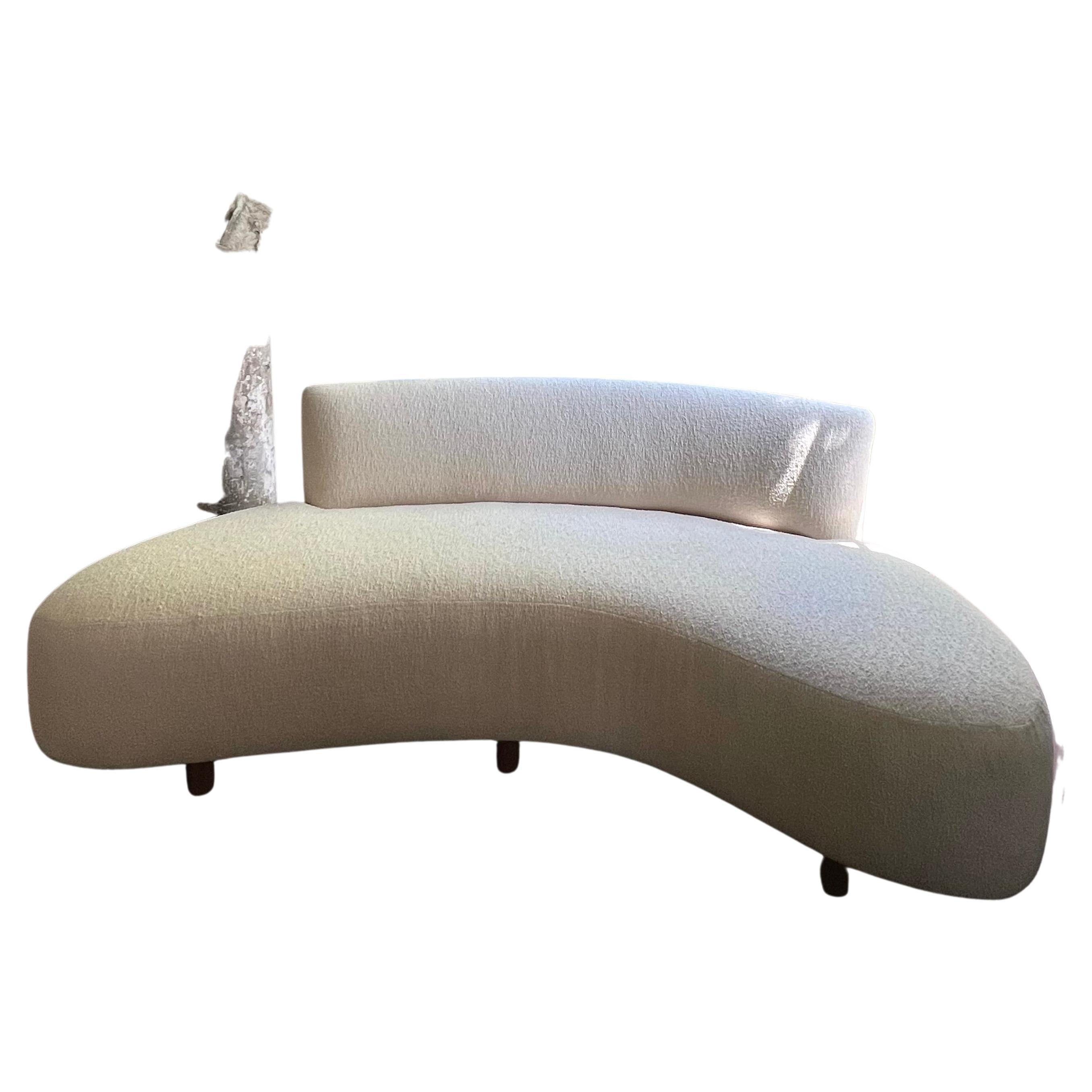 Curved Serpentine-inspired sofa with new creamy boucle upholstery.