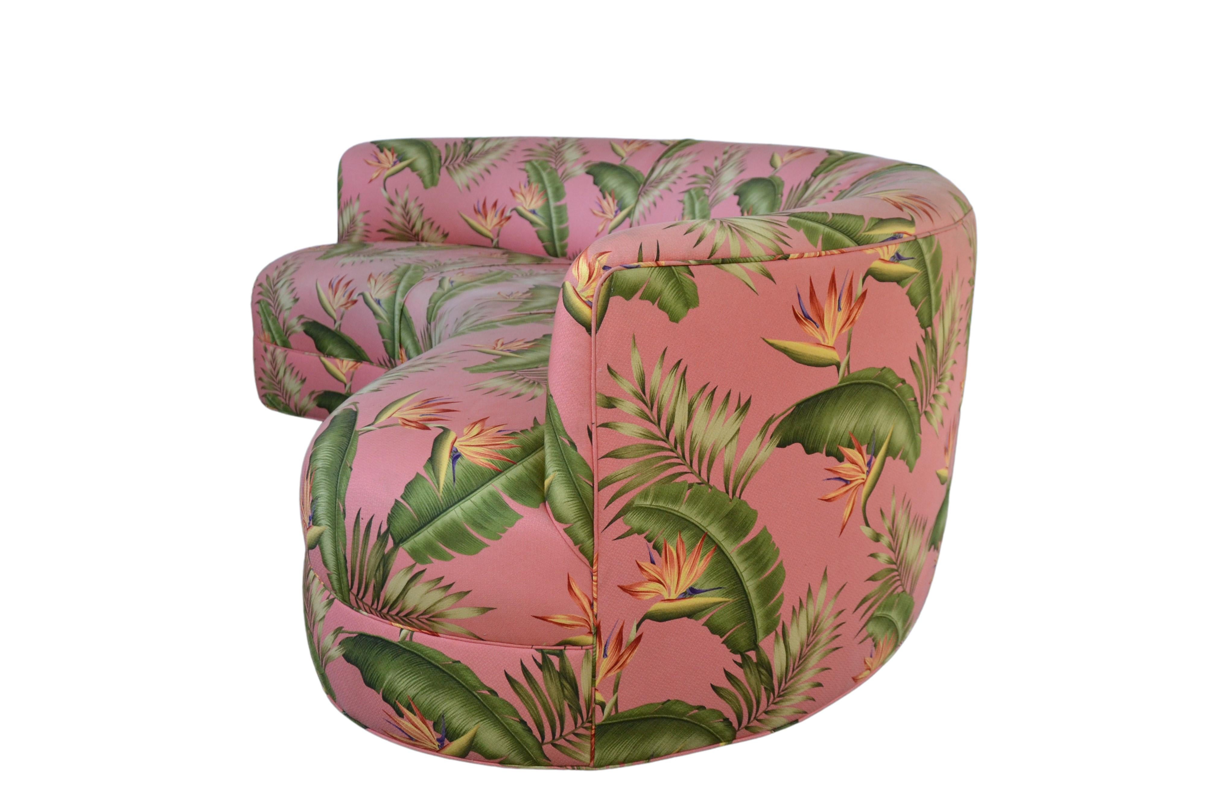 1980s serpentine sofa by Vladimir Kagan. The sofa is covered in a tropical pattern fabric. 
