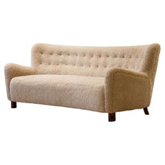 Curved sheeps skin sofa model Fritz Hansen FH 1669, FDB production 1950s