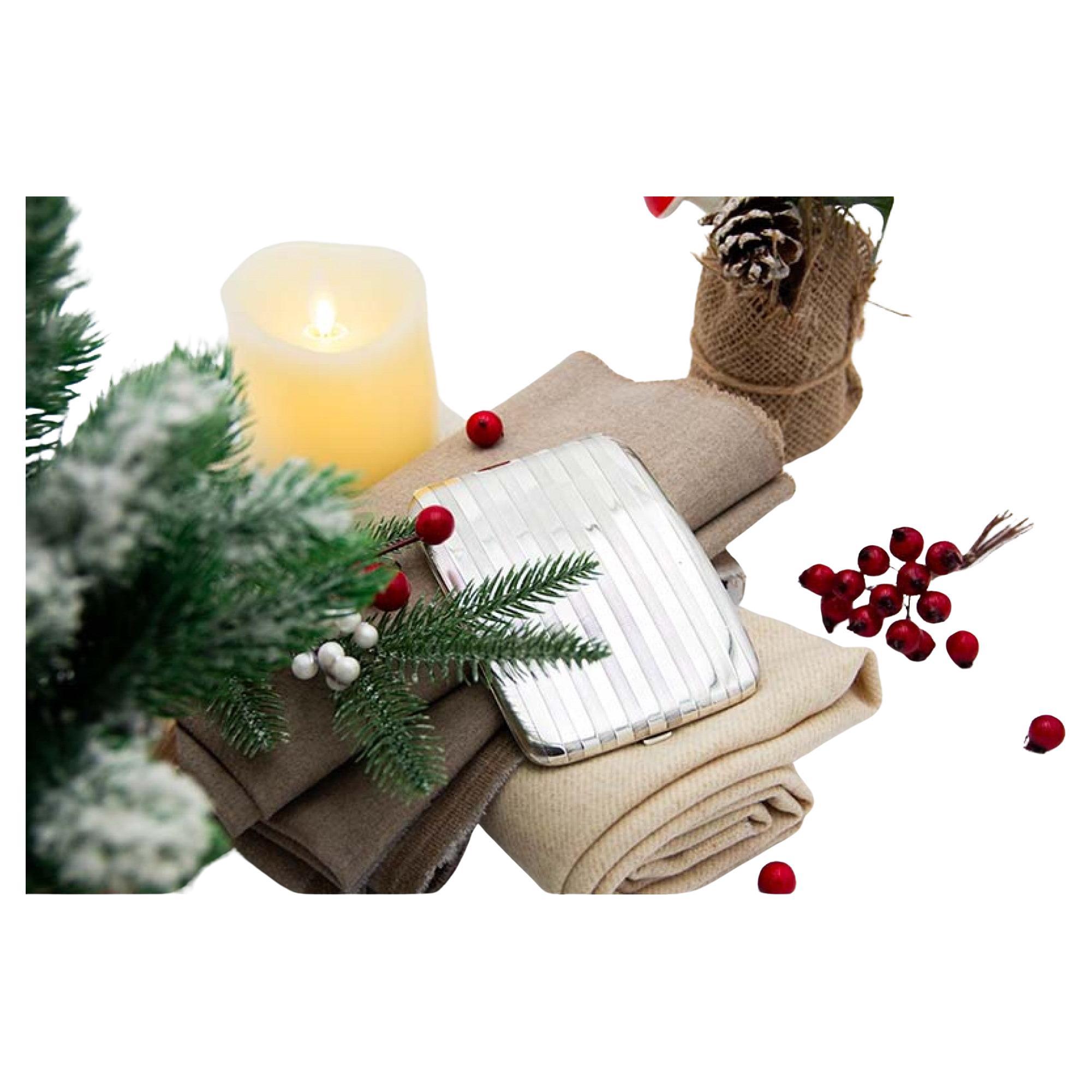 Curved silver case with alternating bands, gold interior and hinged lid