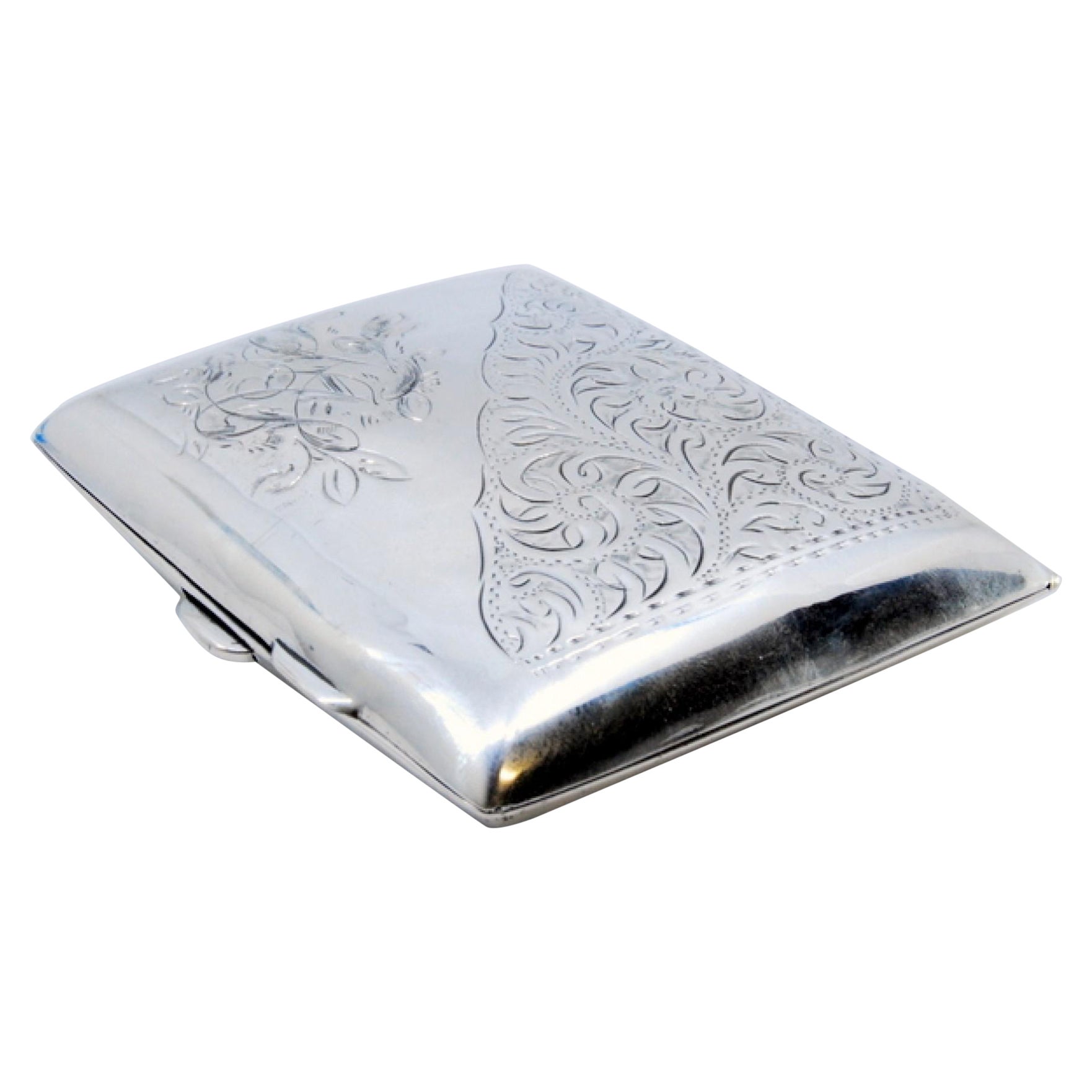 Curved silver case with engraved florals, gold interior and hinged lid