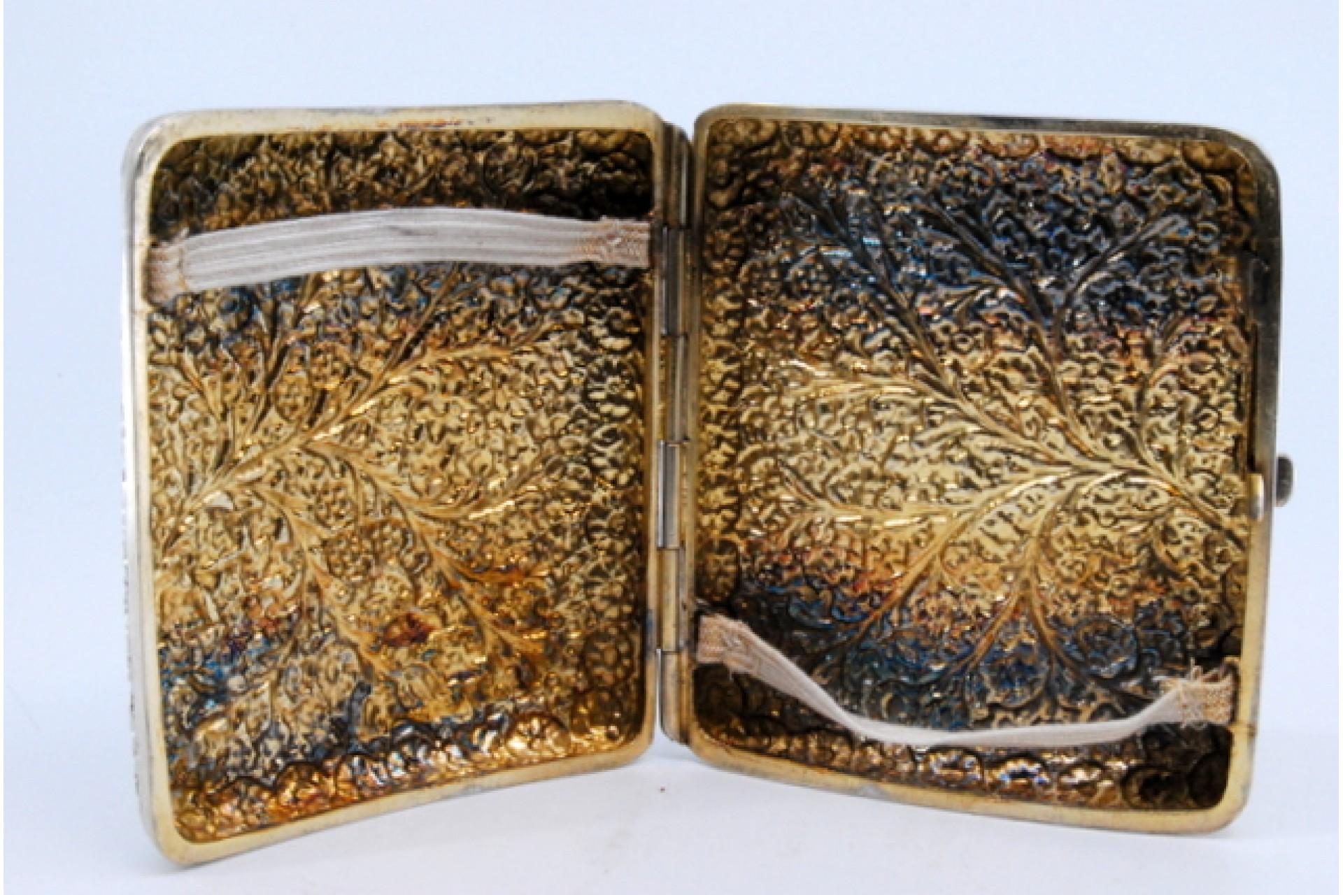 European Curved silver cigarette case with flower and branch reliefs For Sale