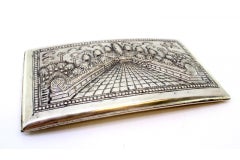 Curved silver cigarette case with the Taj Mahal embossed in a pearly border