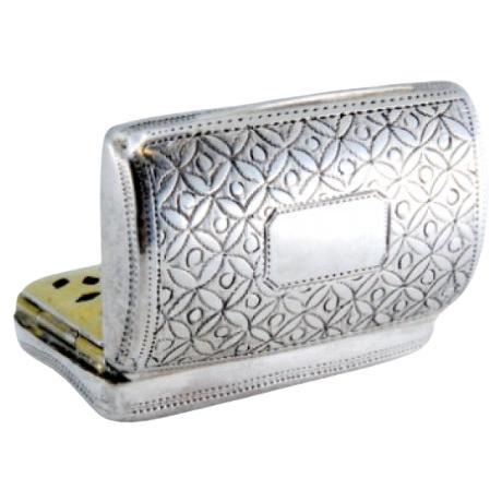 Curved silver-gold vinaigrette box with engraved lid, George III period