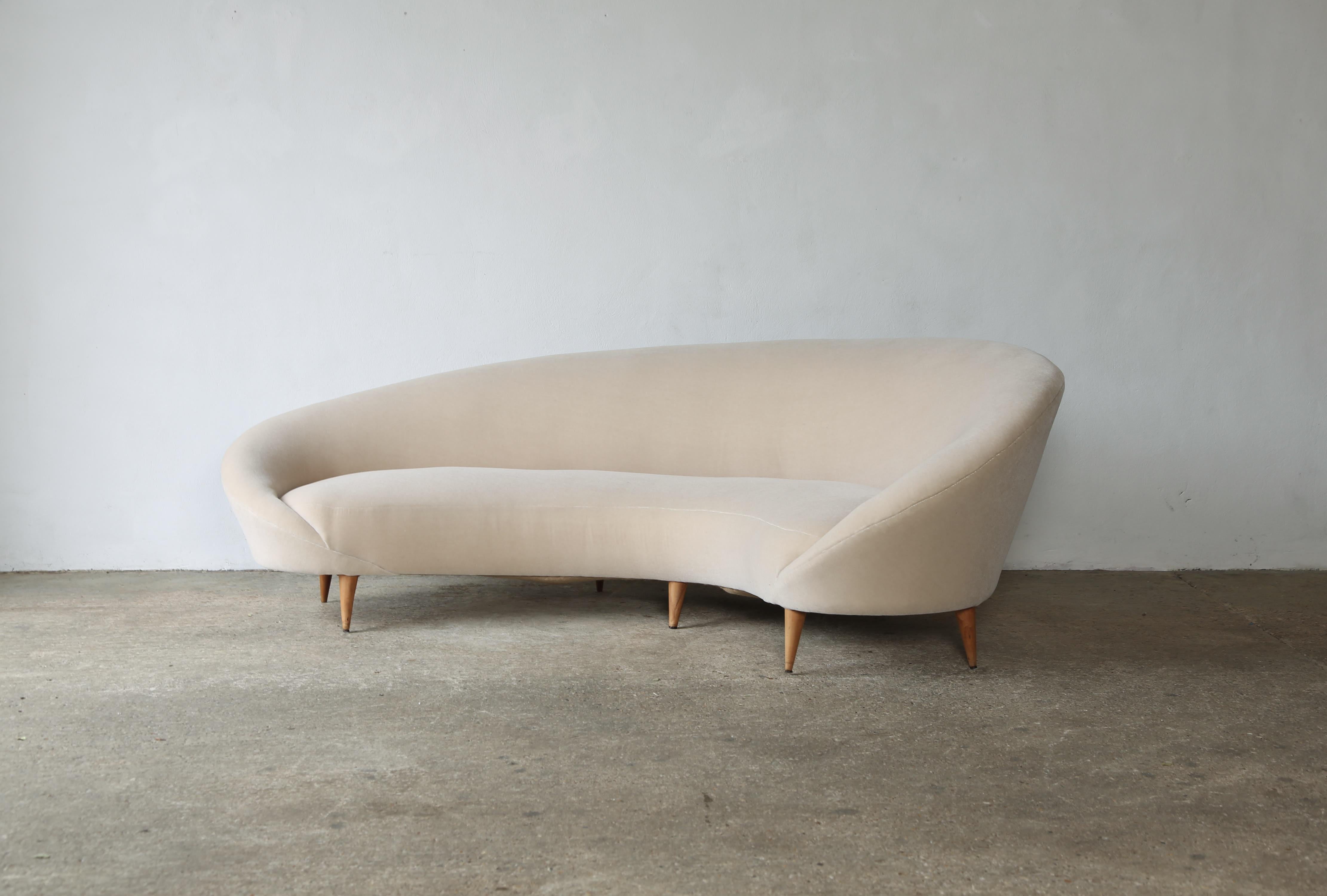 An curved comma sofa, by Federico Munari, Italy. Newly reupholstered in ivory coloured, premium, pure mohair fabric.   Makers label to underside. 


