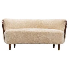 Curved sofa attributed to Viggo Boesen with sheepskin Model 96
