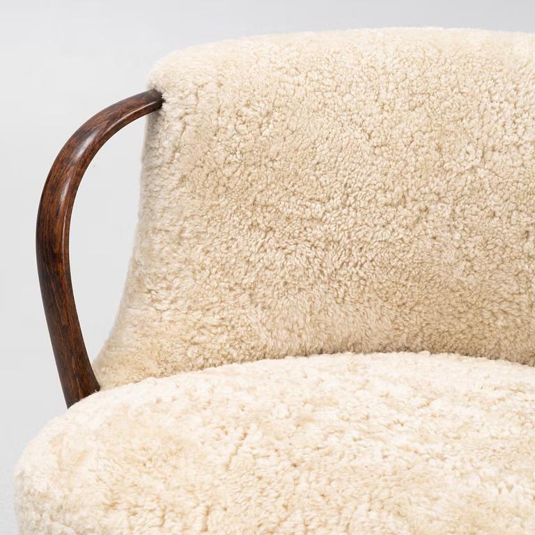 Danish Curved sofa attributed to Viggo Boesen with sheepskin Model 96 For Sale