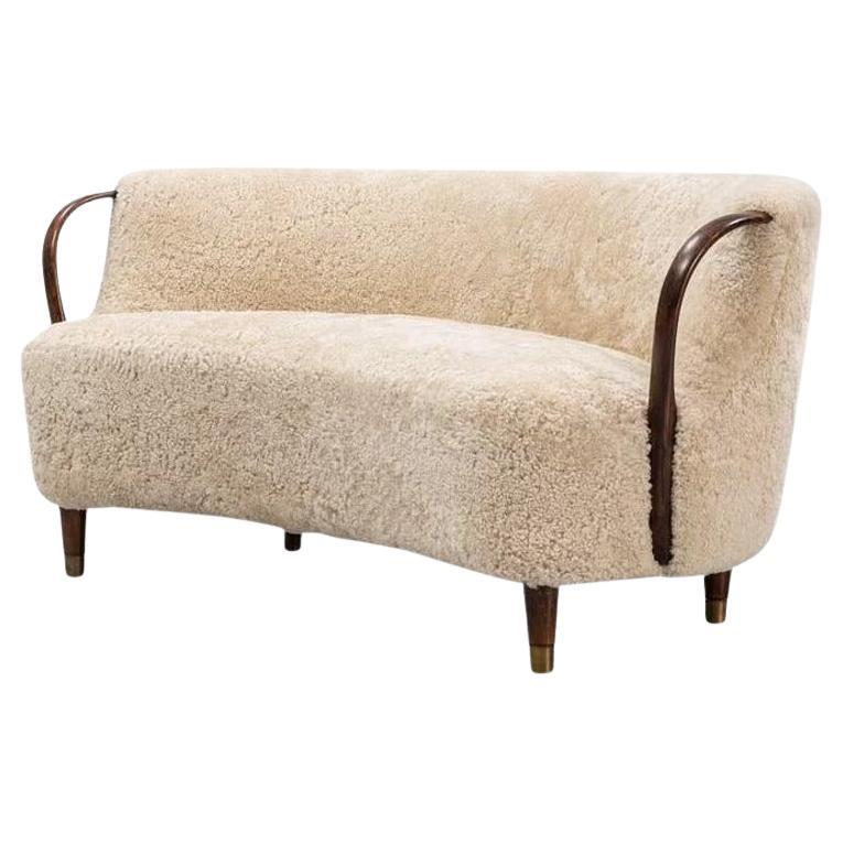 Curved sofa attributed to Viggo Boesen with sheepskin Model 96 For Sale