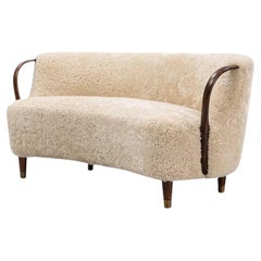 Curved sofa attributed to Viggo Boesen with sheepskin Model 96