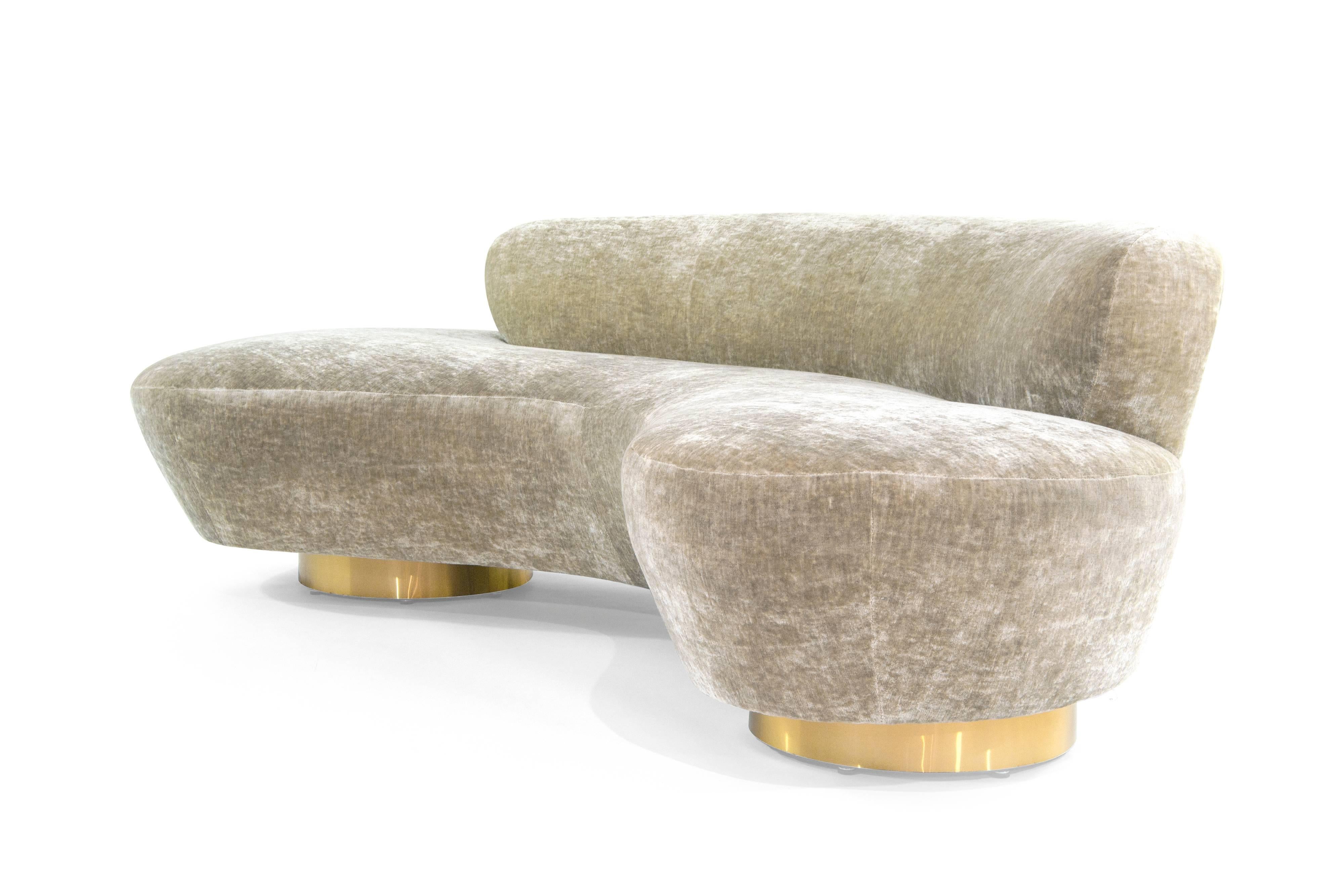 Rare curved sofa designed by the late Vladimir Kagan for Directional, circa 1970s. This rare example features fully restored brass bases as well as Lucite support.

Newly upholstered in grey velvet.
 