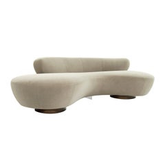 Curved Sofa on Walnut Bases by Vladimir Kagan