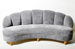 Curved Sofa with Rolled and Tufted Back