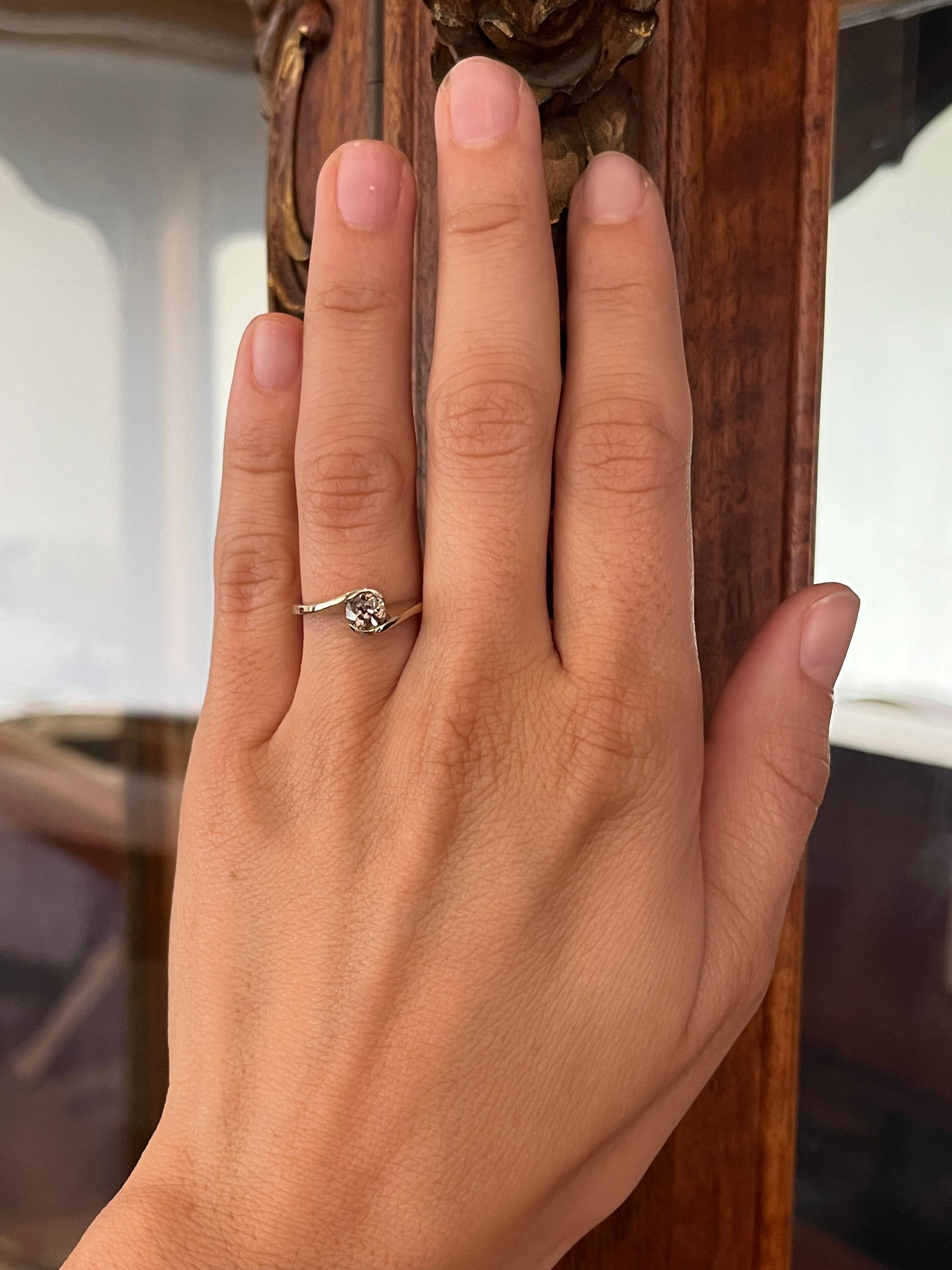A striking modern solitaire with old soul. This 14K white gold ring features a light brown 0.39ct old European cut diamond in a sleek curved setting. Understated and earthy, it’s a one-of-a-kind estate find.

- 0.39ct light brown old European cut
