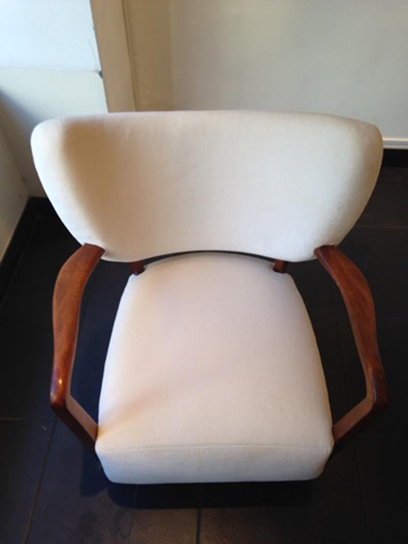 Curved Viggo Boesen armchair produced by master carpenter circa 1940 Denmark.
Newly upholstered with thick ivory Pierre Frey's Teddy Mohair velvet.