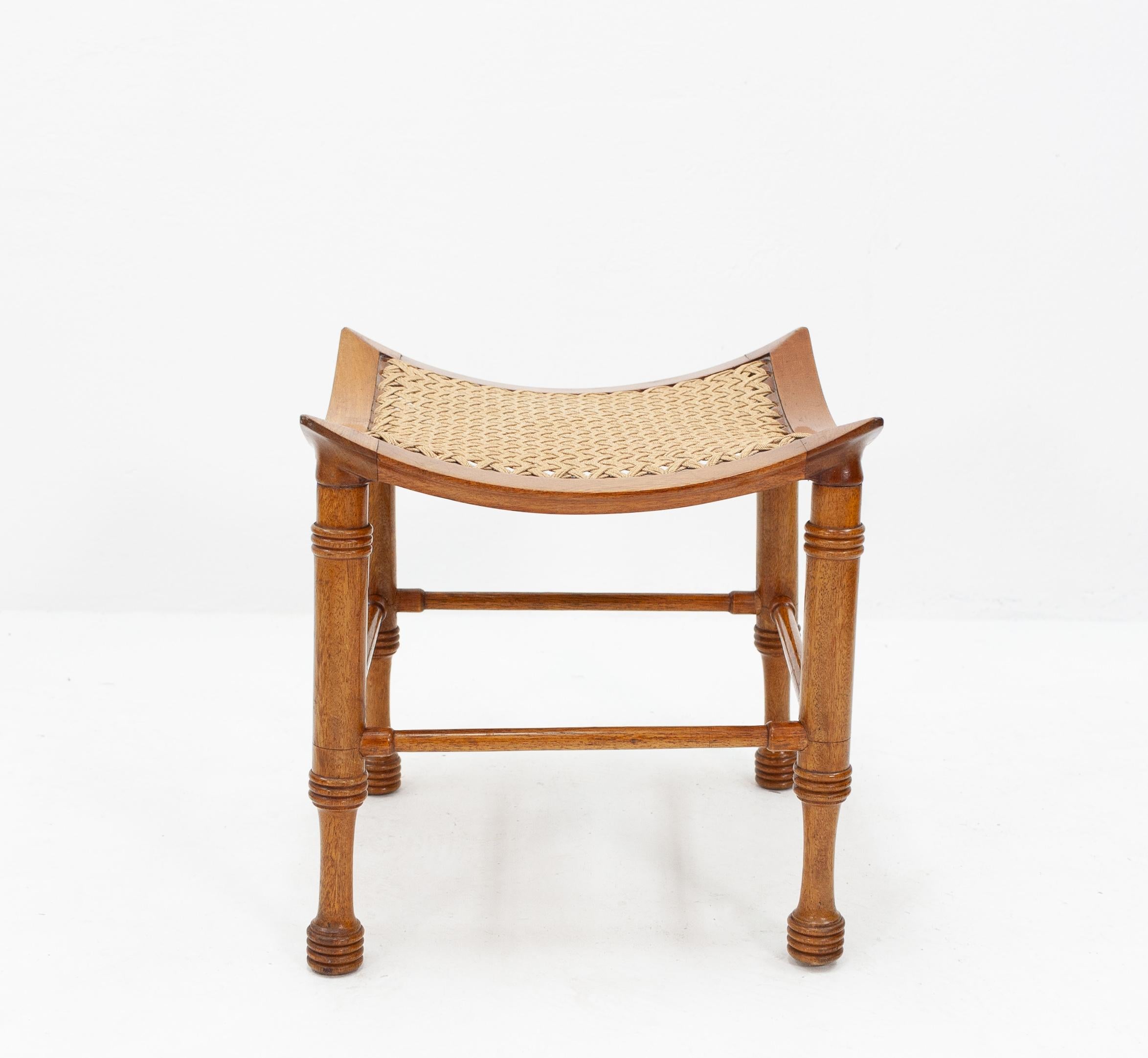 Liberty & Co Thebes Curved walnut with a rope upholstery stool , Very nice elegant stool .Solid walnut
good condition . 1900 /10


   