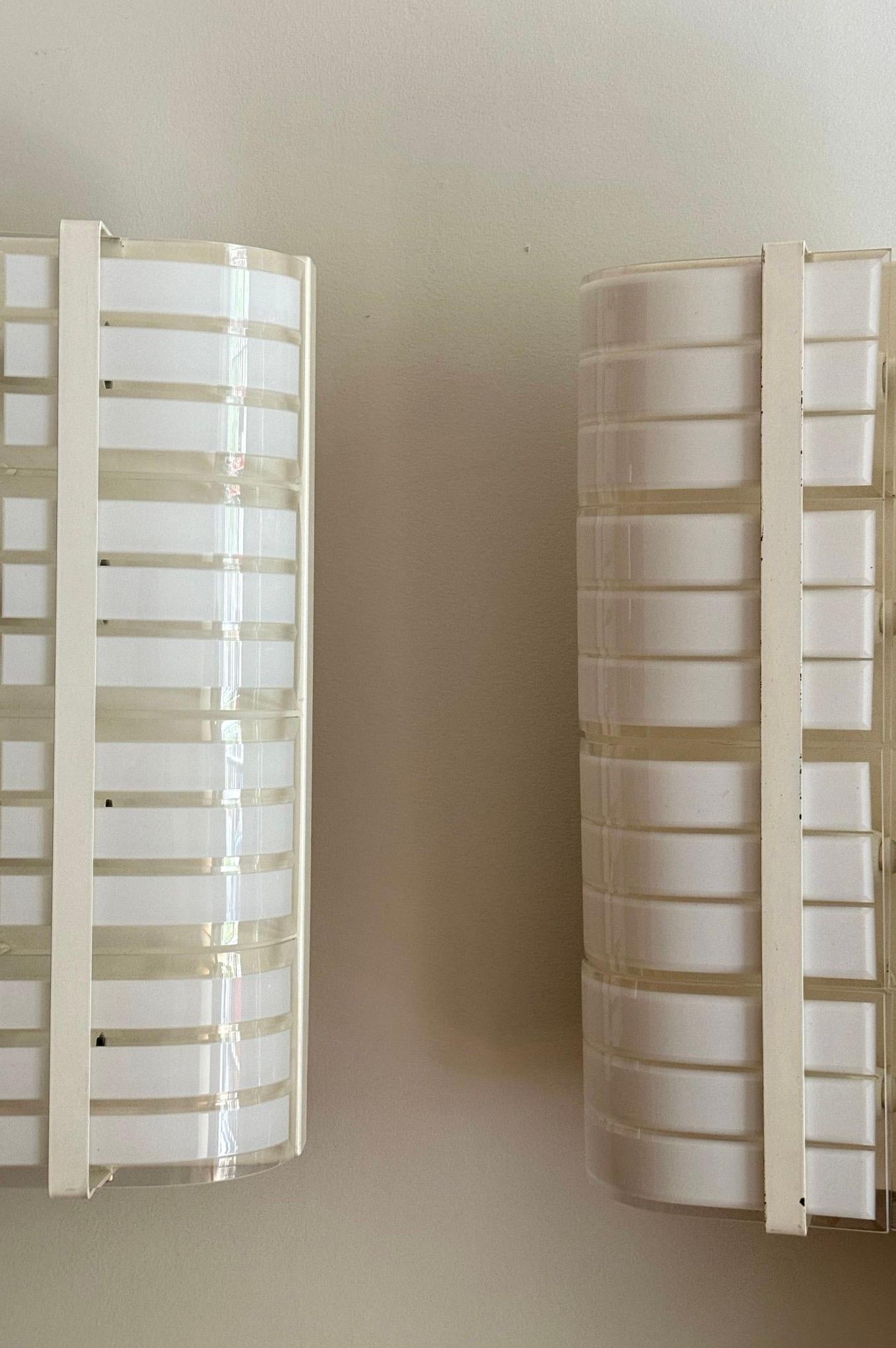 Curved Murano glass and white metal sconces. Italy, 1970s.

