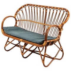 Retro Curved Wicker Settee With Newly Upholstered Green Waxed Canvas Cushion