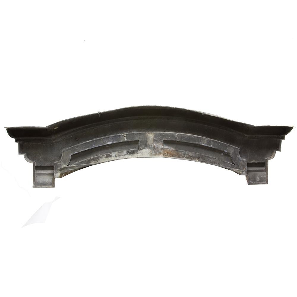 This Victorian zinc architectural header is a uniquely beautiful accent. The perfect weathering and patina with just the right amount of chipped paint are stellar compliments to the simple raised designs on this unusual arched piece.