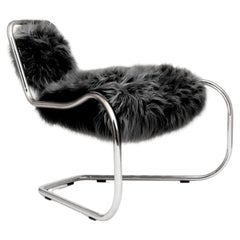 Fauteuil curviligne conçu par Luca Pasqualotti pour Seconda Giovinezza 2024