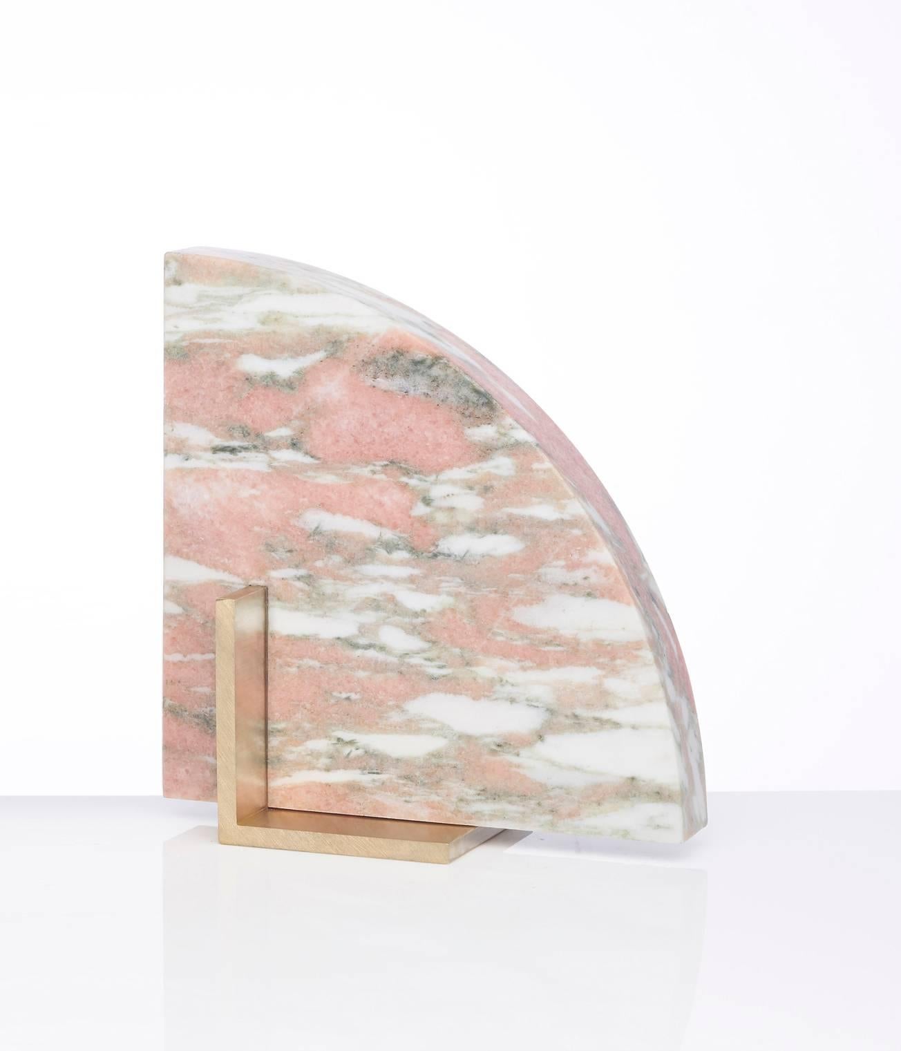 Meet curvy; one half of the odd couple bookends set which are now available to buy individually. You can now mix and match colors and shapes.
Curvy is available in Norwegian rose marble and a brushed brass base.
The marble is cut into a geometric