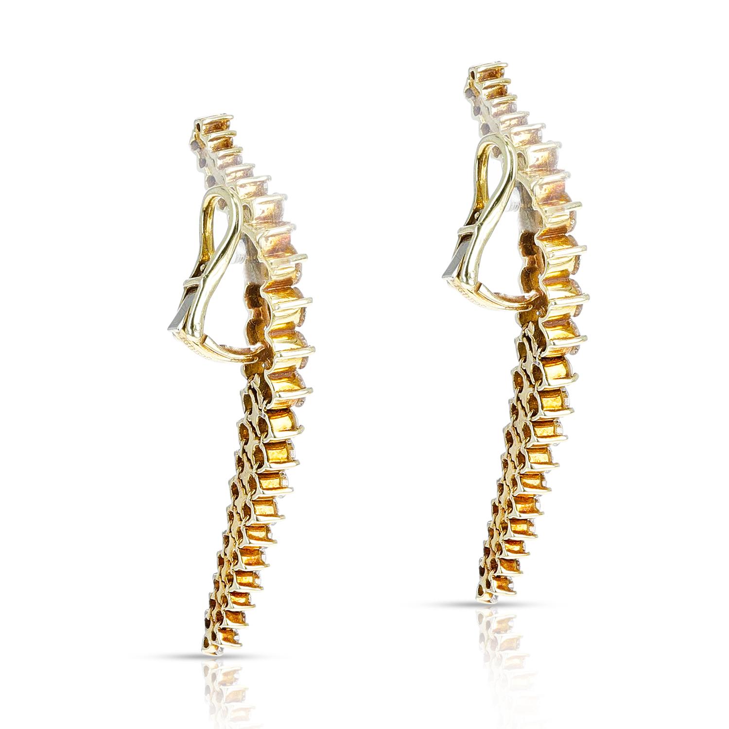 A pair of Curvy Cocktail Dangling Earrings with Round Diamonds by Jose Hess. The total diamond weight is 6.70 carats that are VS clarity. The length is 2 inches of the earrings. The earrings are clip-ons. The round diamonds graduate by size. The
