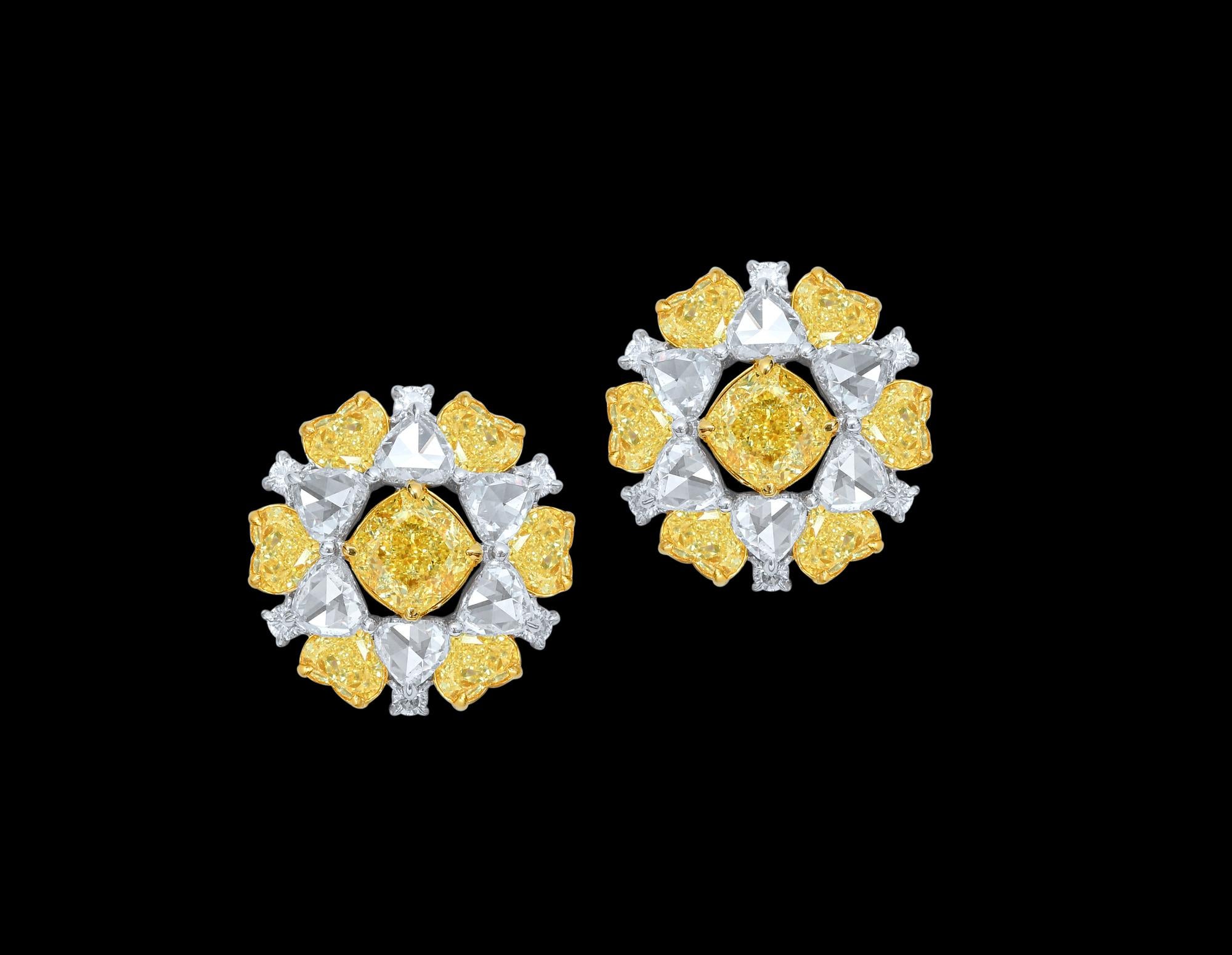 Beautiful pair of cushion shaped diamond floral studs are an all time favorite for female of all ages. 1ct each cushion  shaped fancy colored diamonds are surrounded by perfectly matching heart shape yellow diamonds & flanked with rose cut white