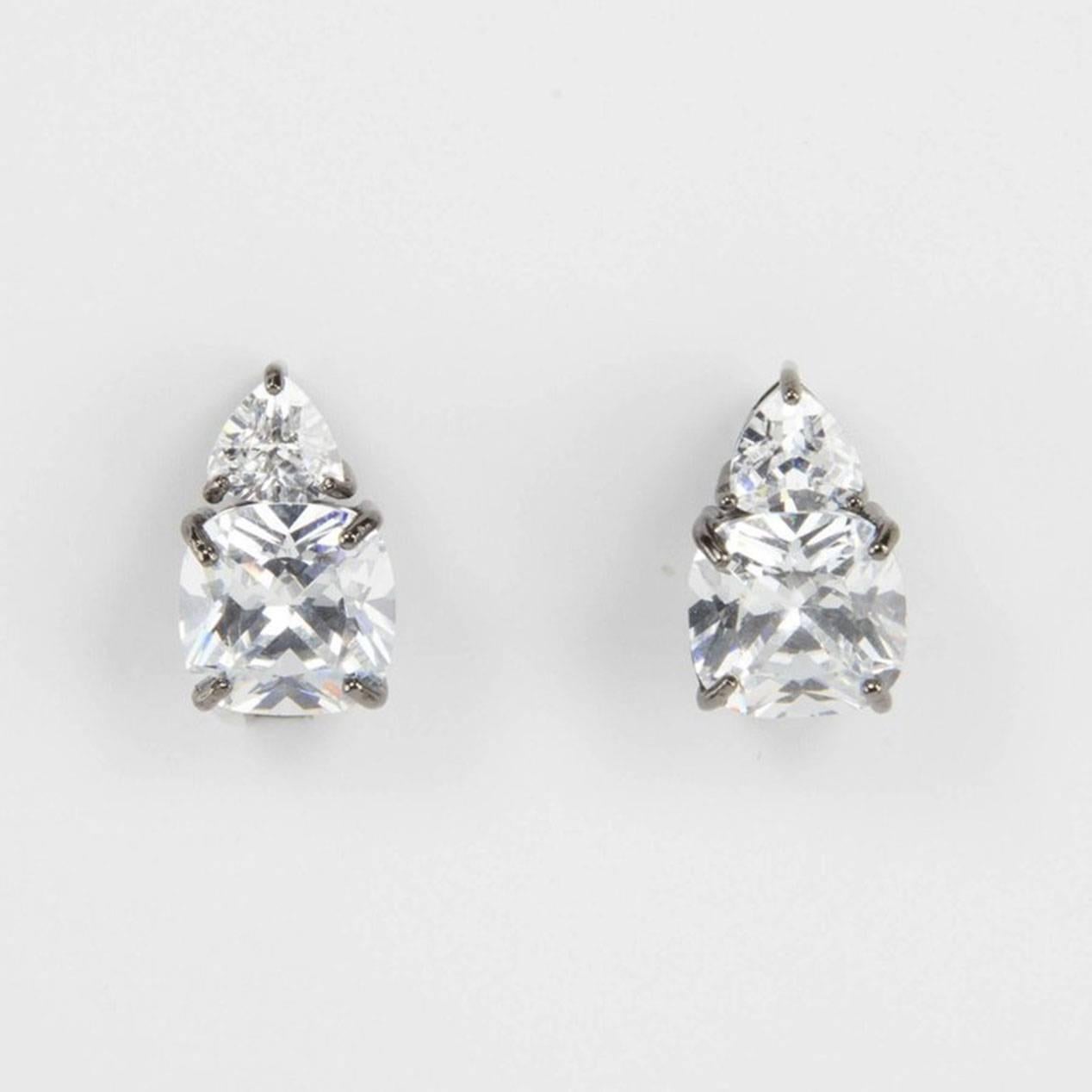 Simply Beautiful…each earring is set with one large square cushion shape faux Diamond, 10mm x 10mm and one Trillion cut faux Diamond, making a striking statement! All hand set in oxidized Sterling Silver. Approx. total length .75