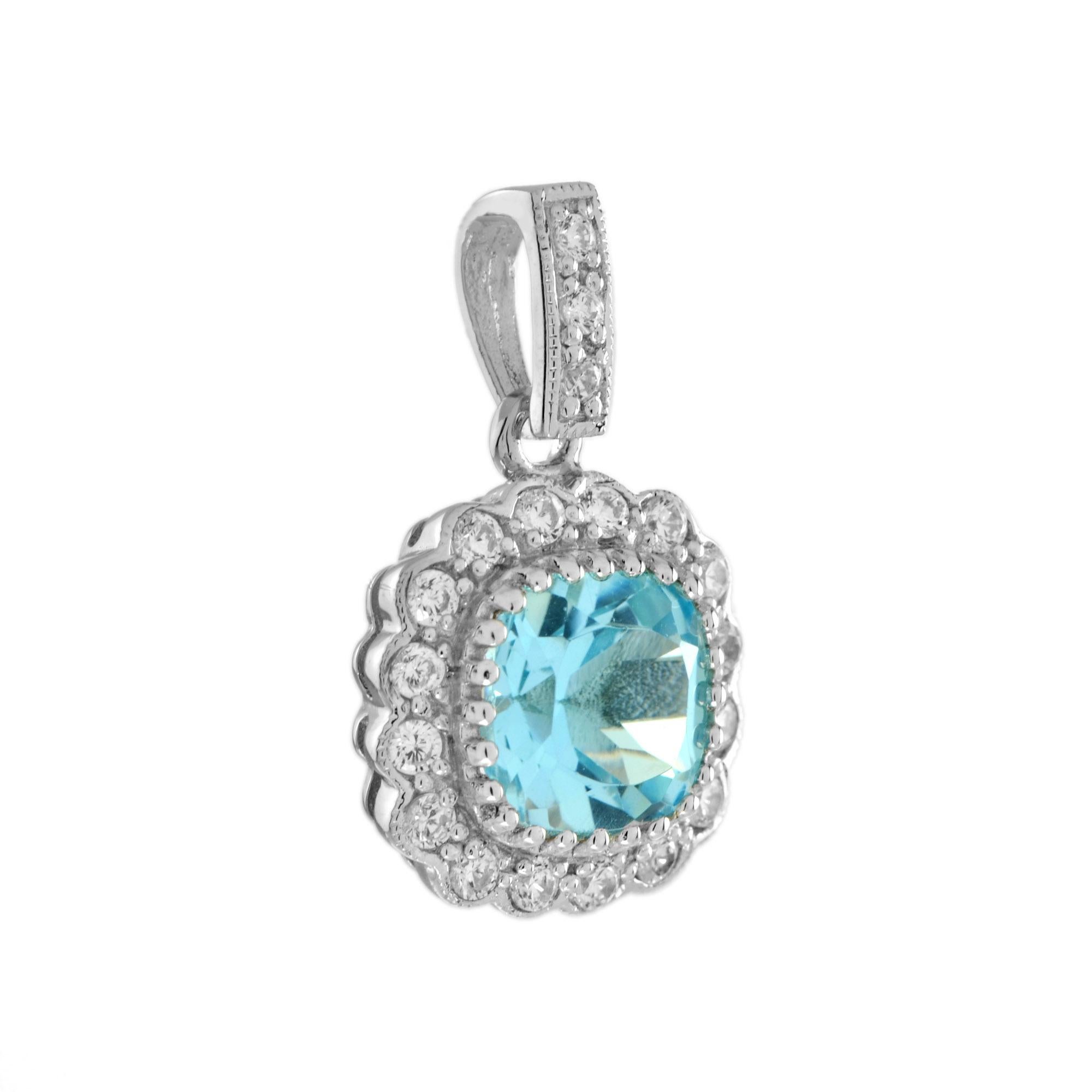 This gorgeous 14k white gold halo pendant feature a total of 1.90 carat cushion-cut blue topaz  surrounded by a halo of diamonds. An effortless upgrade to your accessary wardrobe. Wear it with our same design earrings for your perfect look.