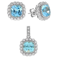 Clous d'oreilles et pendentifs en or blanc 14 carats avec topaze bleue taille coussin et diamants