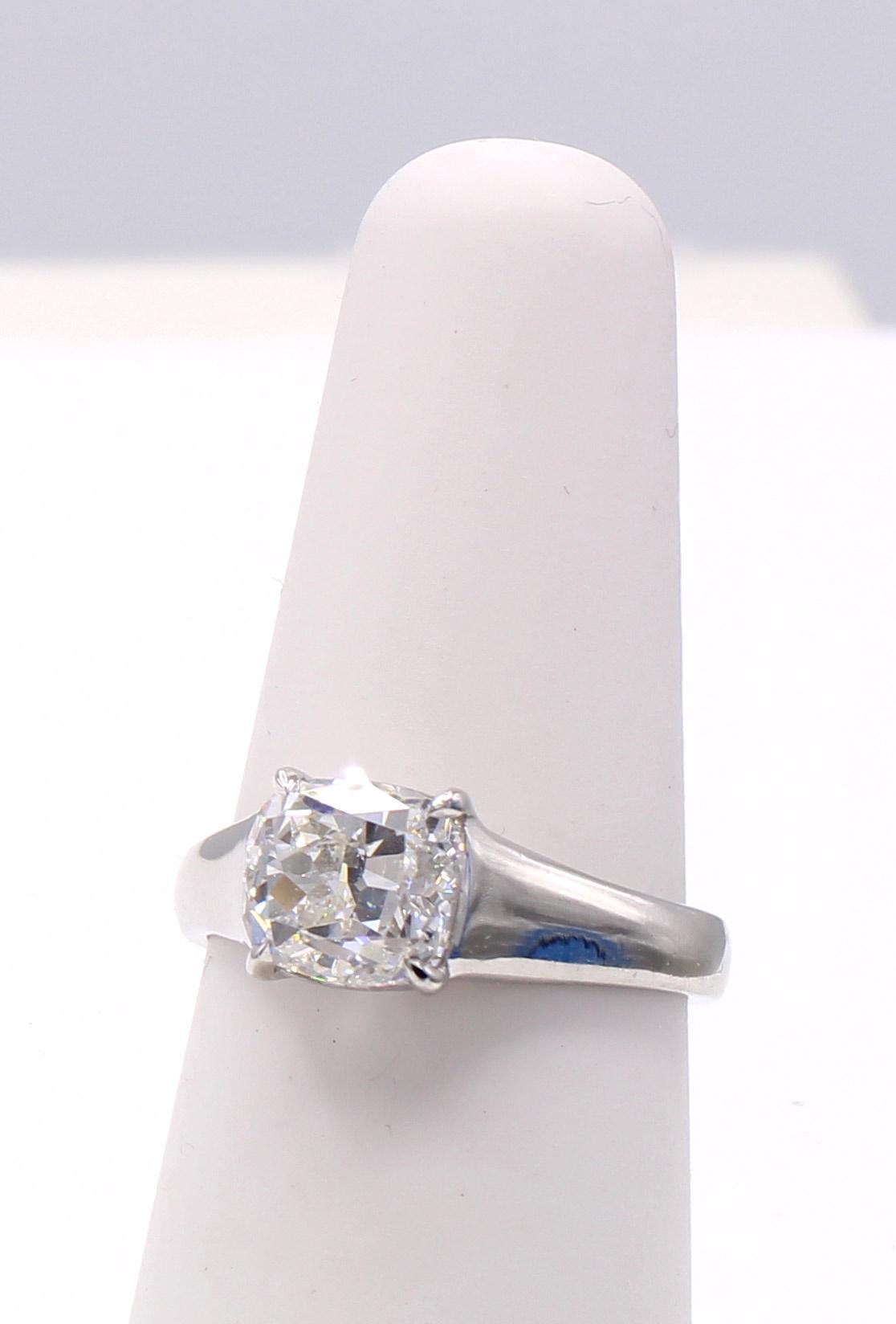 A wonderful well proportioned bright white and brilliant cushion weighing 2.04 carats is the centerpiece of this platinum engagement ring. The cushion comes with a report from the GIA giving it a color grade of H and a clarity grade of VS2.