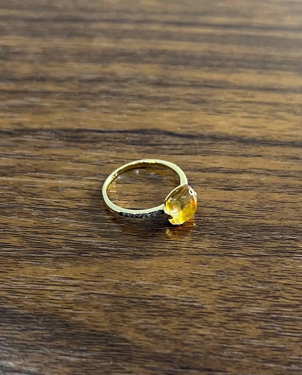 Citrine Gold Ring, features a 4.86-carat citrine set in 14k gold.

This ring showcases a sleek band with a vibrant, cushion-cut citrine centerpiece, exuding a warm, golden hue.

A refined accessory, this citrine gold ring adds a touch of elegance